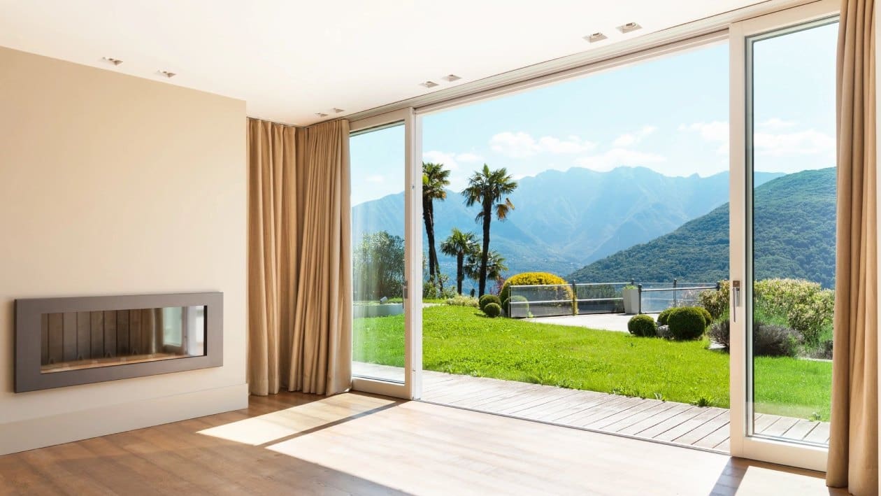 A large sliding glass door in the middle of a room.