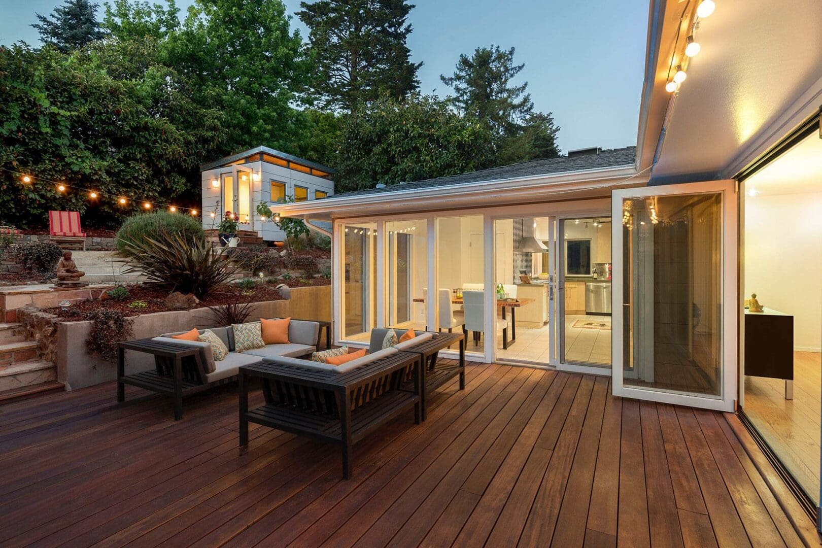 A patio with furniture and sliding glass doors.